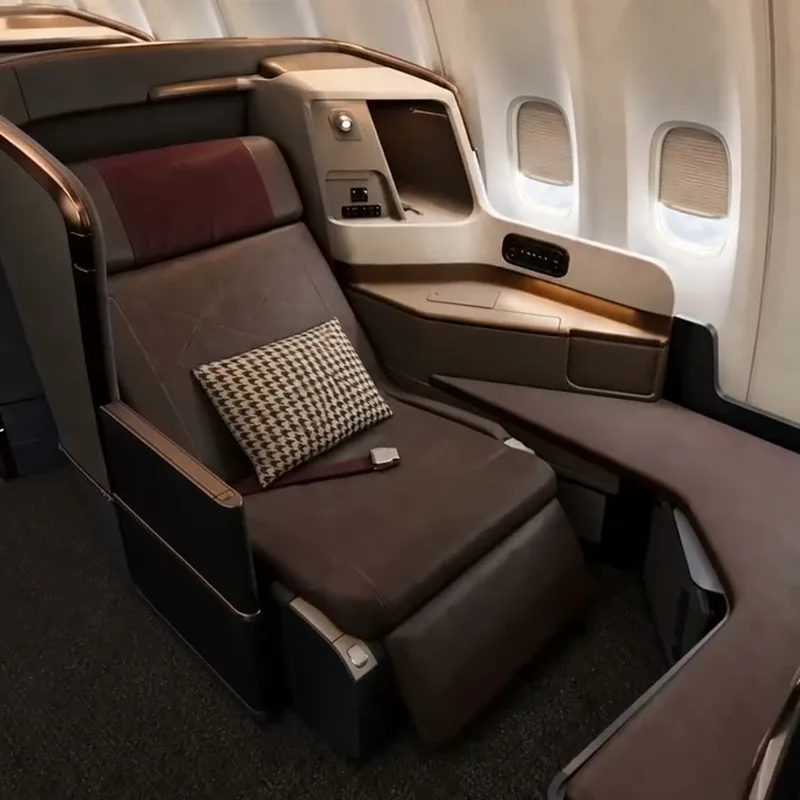 A window seat with a side console and generous legroom